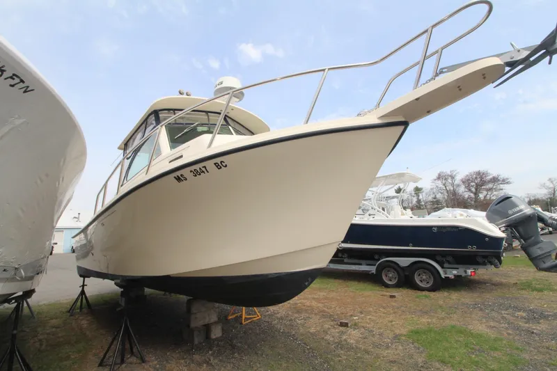Slide: The Image of 2012 Parker 2510 XLD Walkaround boat on stands, side view. - 2
