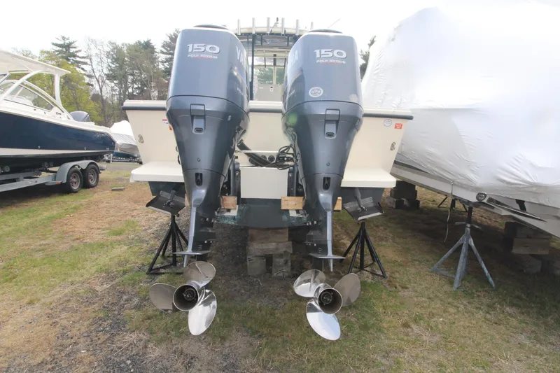 Slide: The Image of 2012 Parker 2510 XLD Walkaround with twin 150 horsepower outboard engines, rear view. - 3