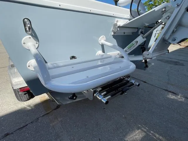 Slide: The Image of 1986 Aquasport Tournament 222 boat with a white swim platform and ladder. - 11