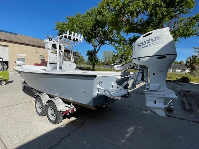 Slide: The Image of 1986 Aquasport Tournament 222 boat with Suzuki outboard motor on trailer. - 2