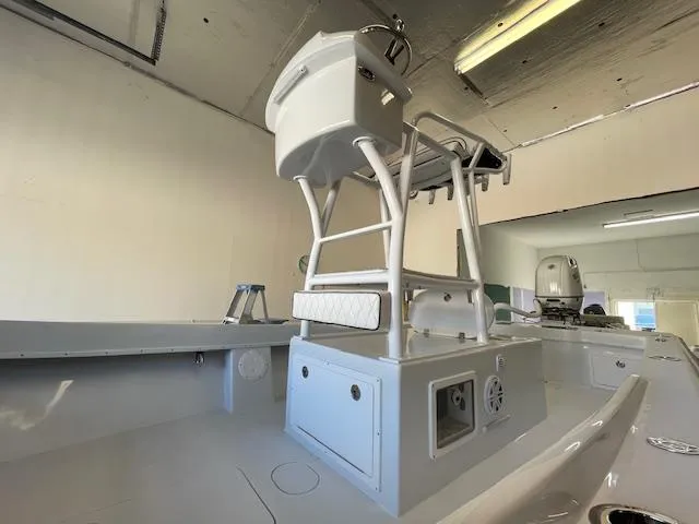 Slide: The Image of 1986 Aquasport Tournament 222 boat interior with elevated helm station in a garage setting. - 25