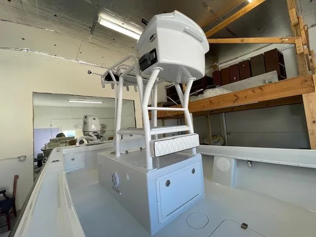 Slide: The Image of 1986 Aquasport Tournament 222 boat interior with elevated helm station in a garage setting. - 26