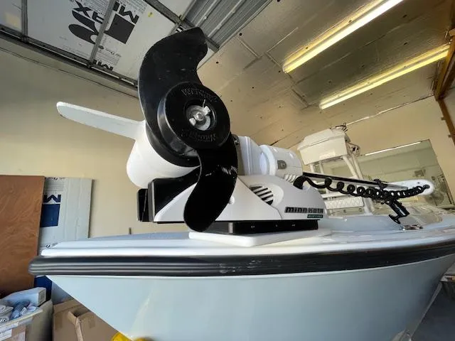 Slide: The Image of 1986 Aquasport Tournament 222 with Minn Kota trolling motor in a garage setting. - 28