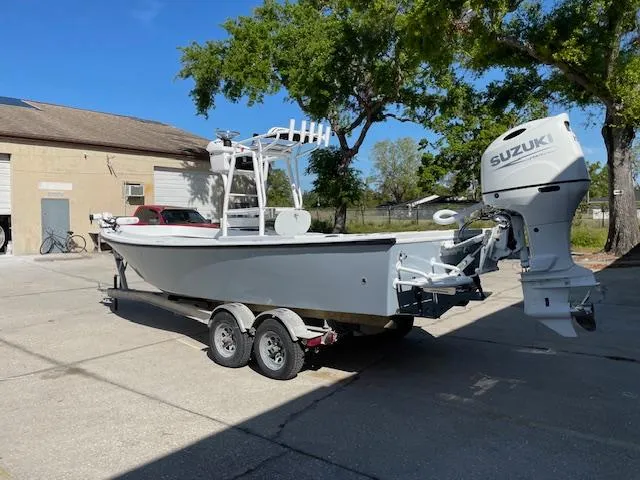 Slide: The Image of 1986 Aquasport Tournament 222 boat with Suzuki outboard motor on a trailer. - 3