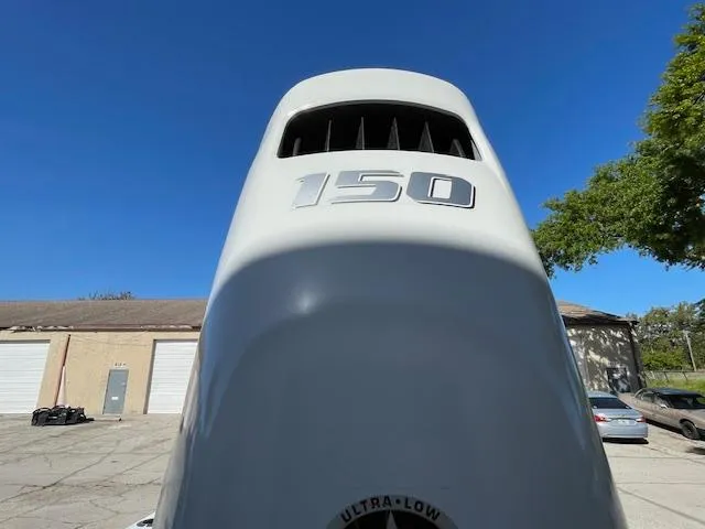 Slide: The Image of Outboard motor with "150" marking on a 1986 Aquasport Tournament 222 boat. - 5