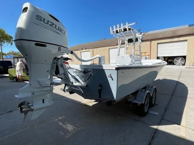 Slide: The Image of 1986 Aquasport Tournament 222 boat with Suzuki outboard motor on a trailer. - 6