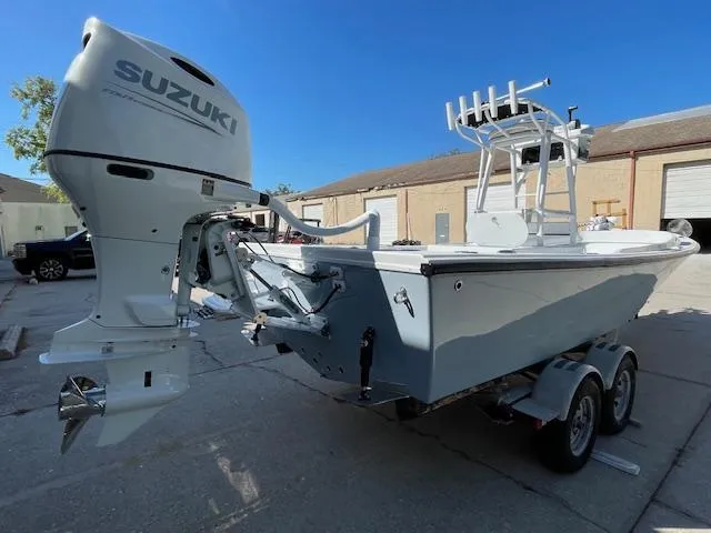 Slide: The Image of 1986 Aquasport Tournament 222 boat with Suzuki outboard motor on trailer. - 7