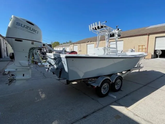 Slide: The Image of 1986 Aquasport Tournament 222 boat with Suzuki outboard motor on a trailer. - 8
