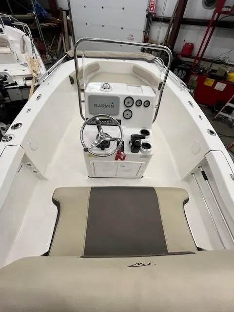 Slide: The Image of 2019 Tidewater 180CC Adventure boat interior with Garmin navigation system and steering console. - 14
