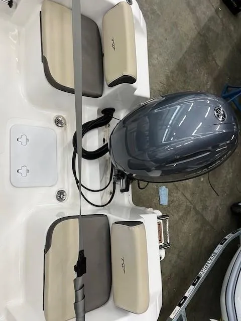 Slide: The Image of 2019 Tidewater 180CC Adventure boat interior with motor and seating. - 16