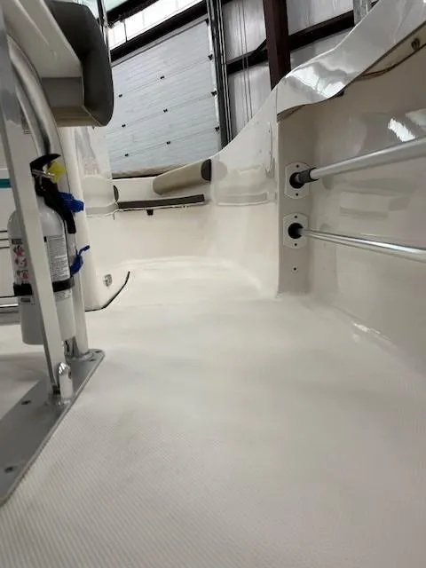 Slide: The Image of 2019 Tidewater 180CC Adventure boat interior, showcasing clean deck and storage features. - 18