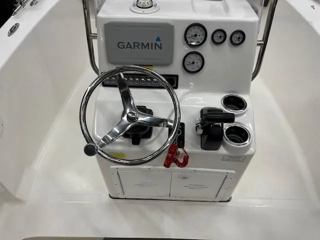 Slide: The Image of 2019 Tidewater 180CC Adventure boat console with Garmin system and steering wheel. - 6