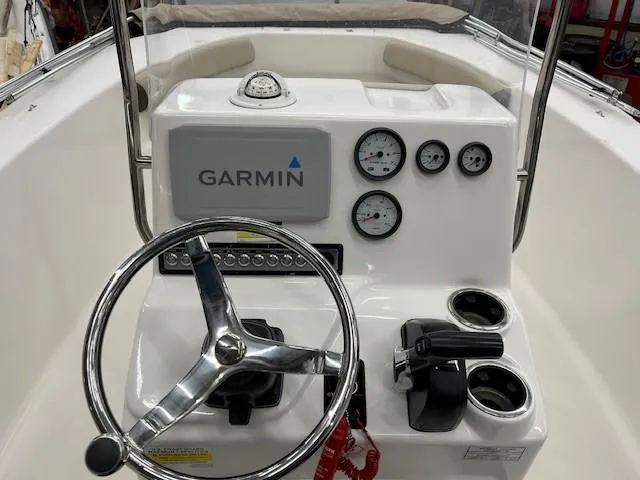 Slide: The Image of 2019 Tidewater 180CC Adventure boat console with Garmin navigation and steering wheel. - 8
