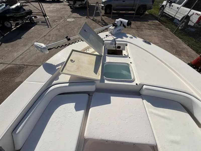Slide: The Image of 2021 Robalo 246 Cayman boat deck with storage compartments and seating. - 14