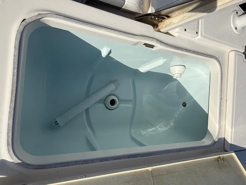 Slide: The Image of Livewell compartment on a 2021 Robalo 246 Cayman boat. - 23