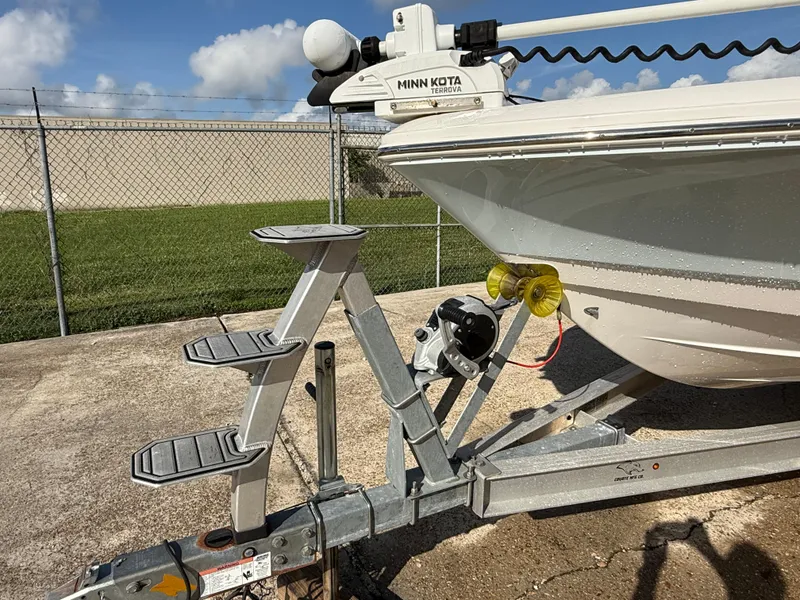 Slide: The Image of 2021 Robalo 246 Cayman boat on trailer with Minn Kota trolling motor. - 28