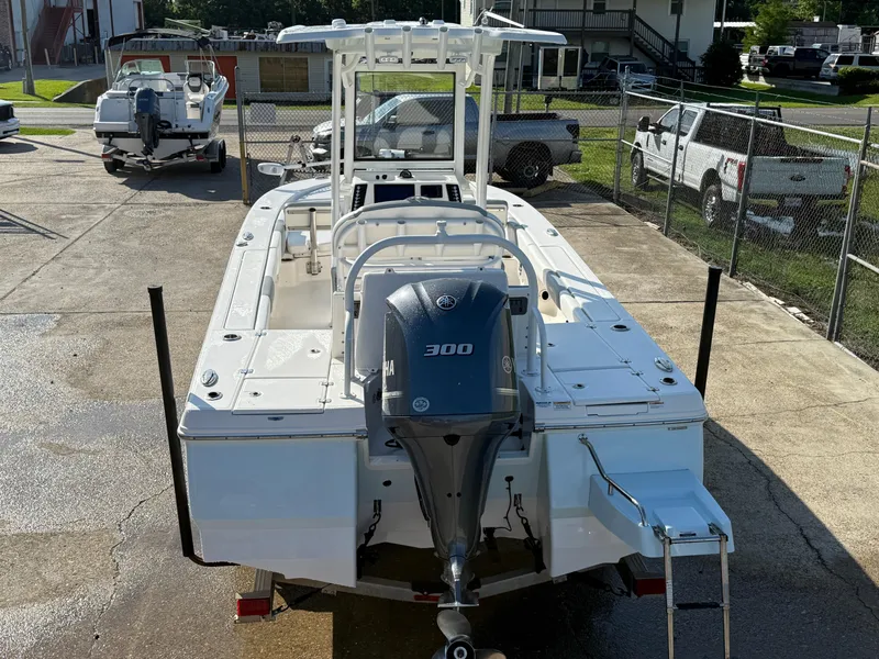 Slide: The Image of 2021 Robalo 246 Cayman boat with 300 HP engine, parked in a lot. - 4
