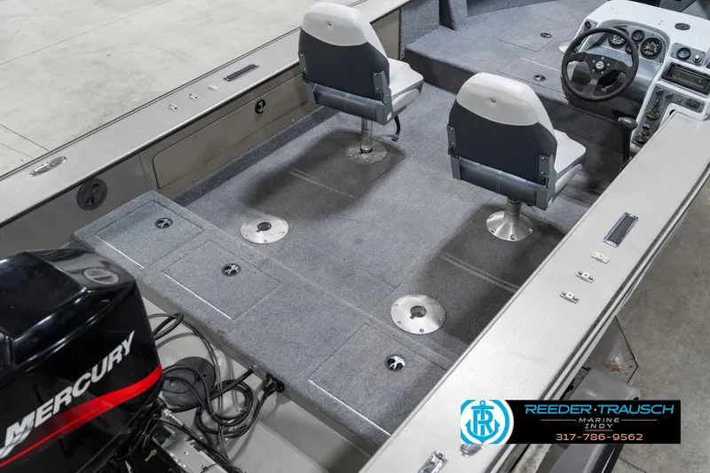 Slide: The Image of 2001 Lund 1775 Pro V SE boat interior with Mercury engine and dual seats. - 12