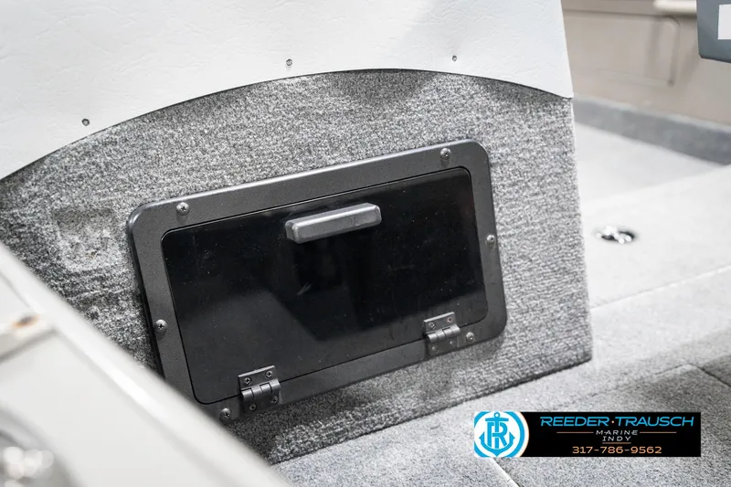 Slide: The Image of Interior of 2001 Lund 1775 Pro V SE boat with storage compartment. - 23