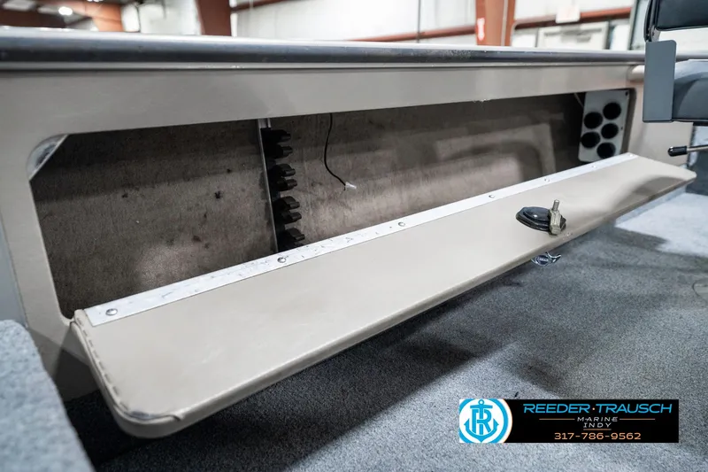 Slide: The Image of 2001 Lund 1775 Pro V SE boat interior storage compartment with open hatch. - 28