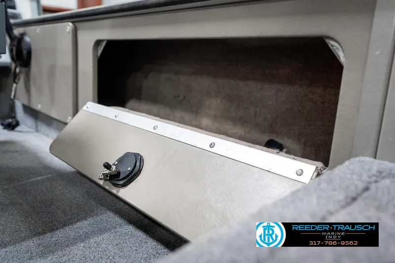 Slide: The Image of Open storage compartment in a 2001 Lund 1775 Pro V SE boat interior. - 30