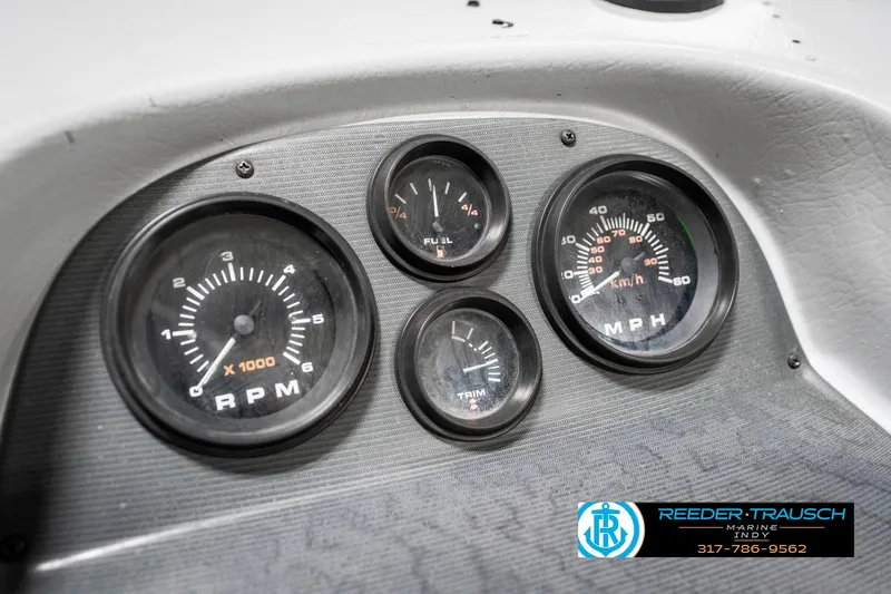Slide: The Image of Dashboard of a 2001 Lund 1775 Pro V SE boat with RPM and MPH gauges. - 39