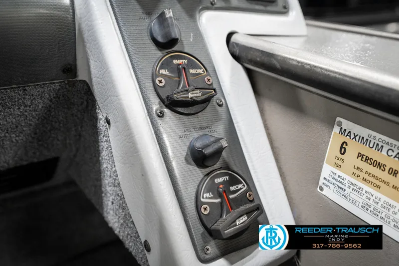 Slide: The Image of Control panel of a 2001 Lund 1775 Pro V SE boat, showing gauges and capacity label. - 42