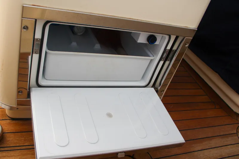 Slide: The Image of Open storage compartment on 2014 Chris-Craft Catalina 29 Sun Tender boat. - 11