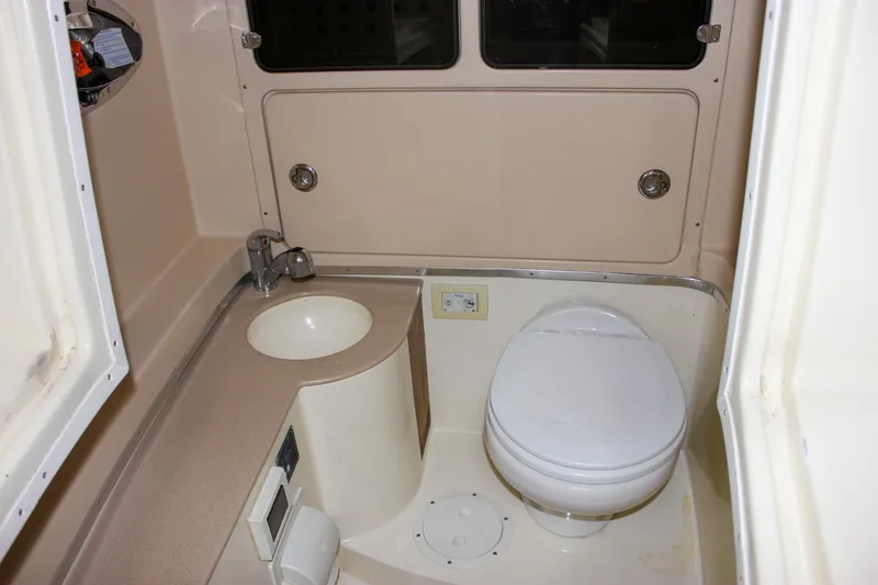 Slide: The Image of 2014 Chris-Craft Catalina 29 Sun Tender bathroom with sink and toilet. - 23