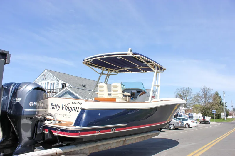 Slide: The Image of 2014 Chris-Craft Catalina 29 Sun Tender boat on trailer, parked on street. - 31