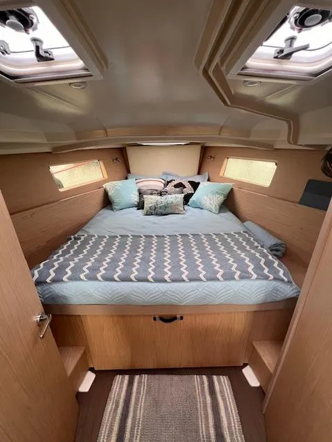 Slide: The Image of Cozy cabin interior of 2017 Beneteau Oceanis 41.1 with comfortable bedding and natural light. - 16