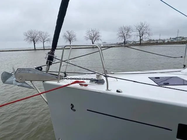 Slide: The Image of Sailboat Beneteau Oceanis 41.1 (2017) anchored on a calm lake with overcast skies. - 3
