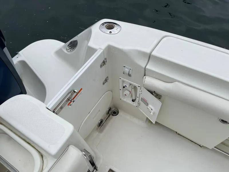 Slide: The Image of 2005 Hydra-Sports 3300 VX boat interior with open storage compartments. - 19