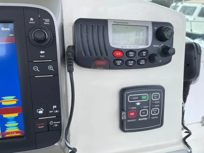 Slide: The Image of Control panel of a 2005 Hydra-Sports 3300 VX boat with navigation and communication equipment. - 24