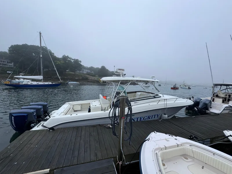Slide: The Image of 2005 Hydra-Sports 3300 VX boat docked on a foggy marina. - 32