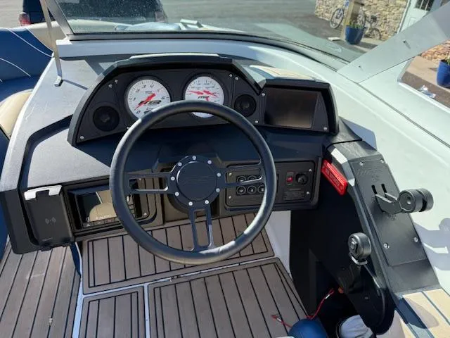 Slide: The Image of Cockpit of 2022 MB B-52 boat with steering wheel and dashboard controls. - 14