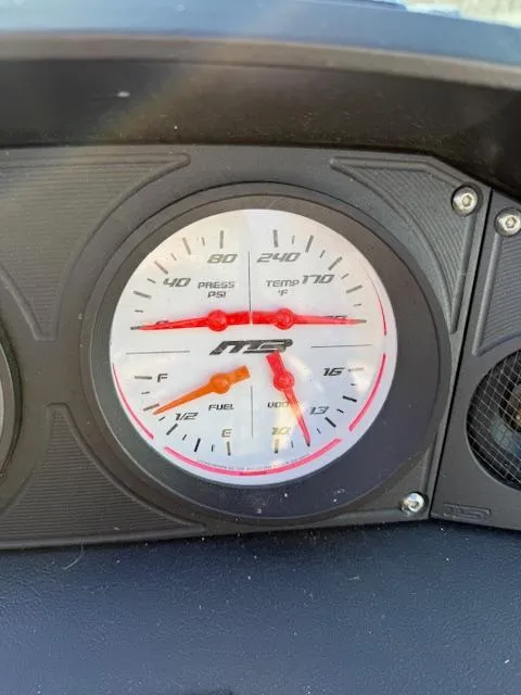 Slide: The Image of Dashboard gauge of 2022 MB B-52 showing pressure, temperature, fuel, and voltage levels. - 16