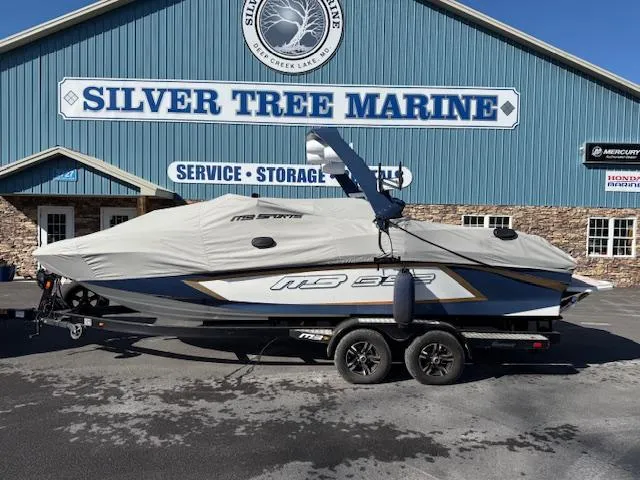 Slide: The Image of 2022 MB B-52 boat covered, parked at Silver Tree Marine. - 2