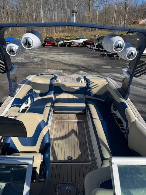 Slide: The Image of 2022 MB B-52 boat interior with blue and beige seating, outdoor setting. - 4