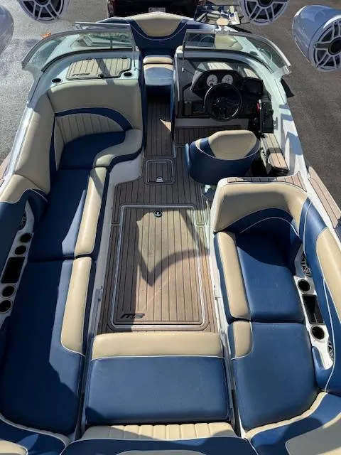 Slide: The Image of Luxurious 2022 MB B-52 boat interior with blue and beige seating, sleek design. - 6