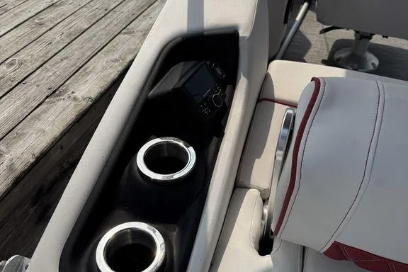 Slide: The Image of 2021 Bennington 24 RTSB boat interior with cup holders and seating detail. - 11