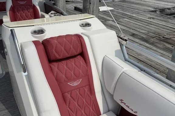 Slide: The Image of Luxurious seating on 2021 Bennington 24 RTSB boat with red and white upholstery. - 14
