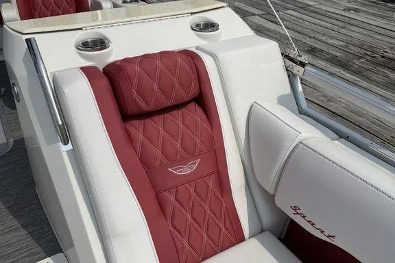 Slide: The Image of Luxurious seating on 2021 Bennington 24 RTSB boat with red and white upholstery. - 20