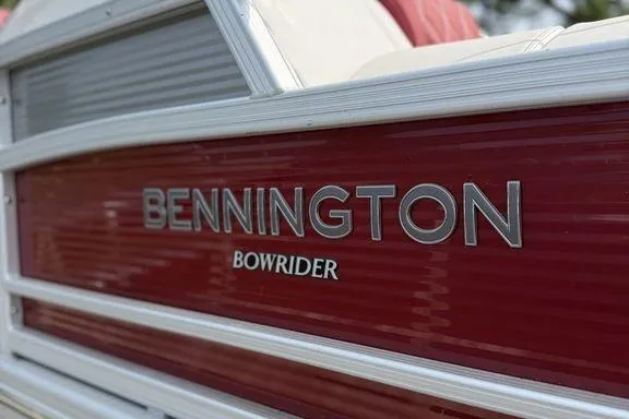 Slide: The Image of 2021 Bennington 24 RTSB Bowrider with red and white detailing. - 4