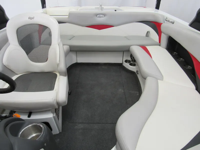 Slide: The Image of Interior of 2009 Tigé 22 EV boat with gray and red seating. - 10