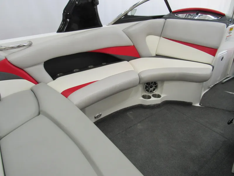 Slide: The Image of 2009 Tigé 22 EV boat interior with gray and red seating, modern design. - 4