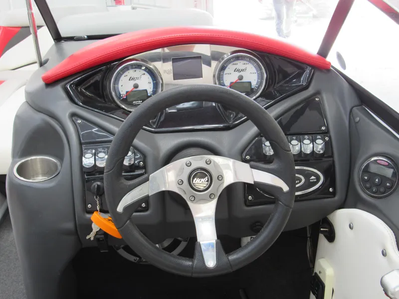 Slide: The Image of 2009 Tigé 22 EV boat dashboard with steering wheel and instrument panel. - 7