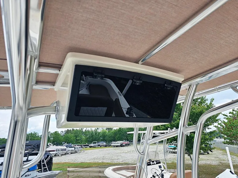 Slide: The Image of 2025 Pioneer 202 Sportfish boat with mounted electronic display under canopy. - 15