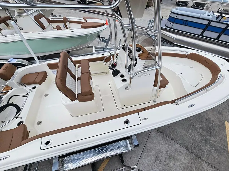 Slide: The Image of 2025 Pioneer 202 Sportfish boat with brown seating and sleek design. - 7