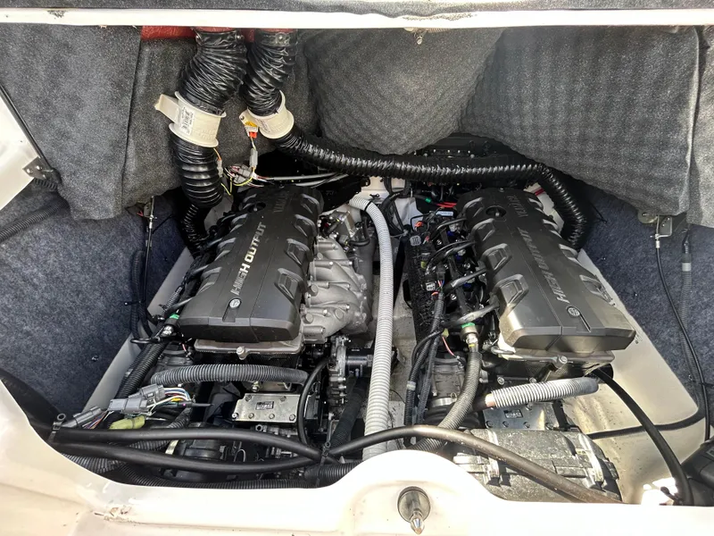 Slide: The Image of 2020 Yamaha Boats 242 Limited S engine compartment with dual engines and wiring. - 10